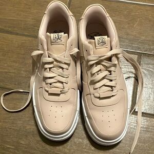 Nike size 11 nude/ blush colored shoes.
